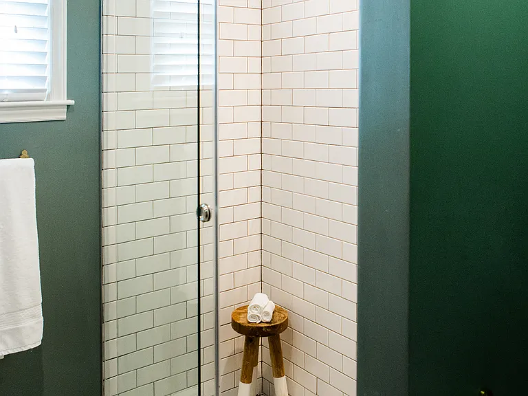 primary bathroom, zero barrier shower with rain head and wand.