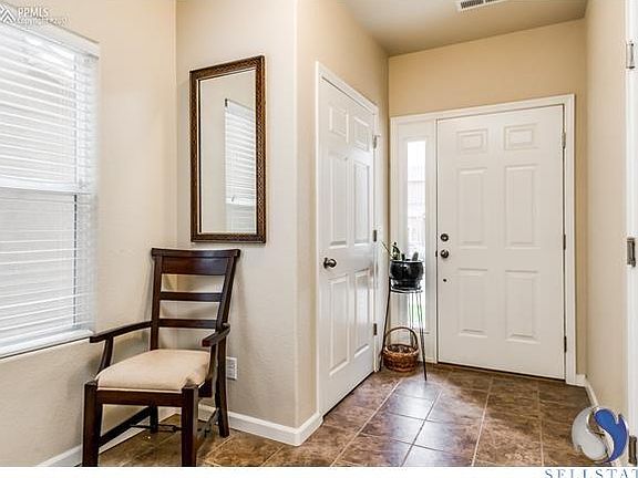 Entry has access to the garage as well as storage in the coat closet.