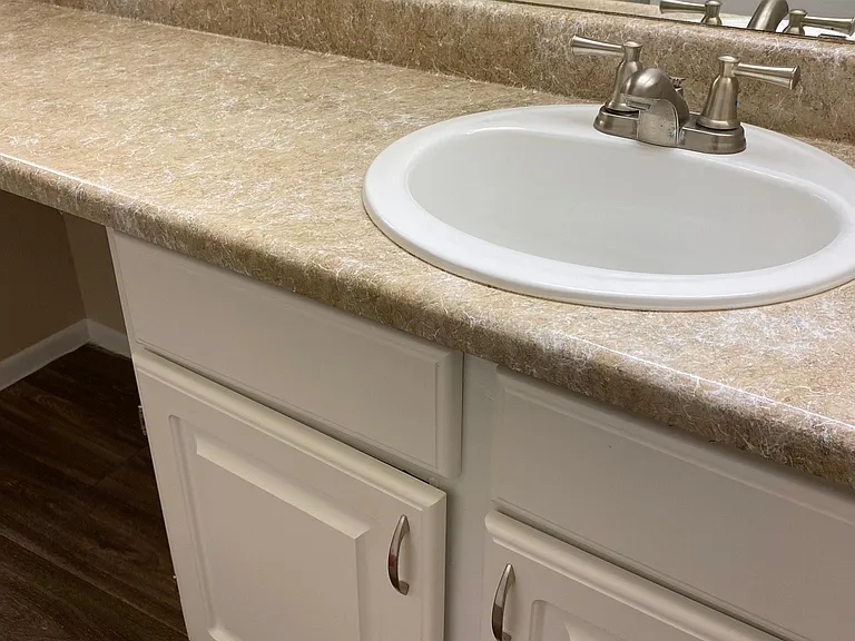 downstairs 2 bedroom - main bedroom bathroom - sink & cabinet