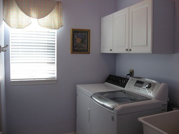 Laundry Room, Main Floor
						:
						Window looks into backyard, has utility tub.