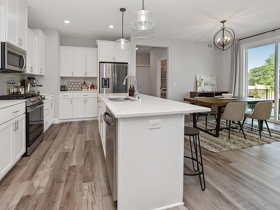 Open-concept kitchen/living/dining room