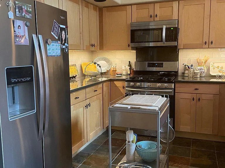 Kitchen is fitted with gourmet cookware and utensils. Stainless steel appliances. Separate pantry.