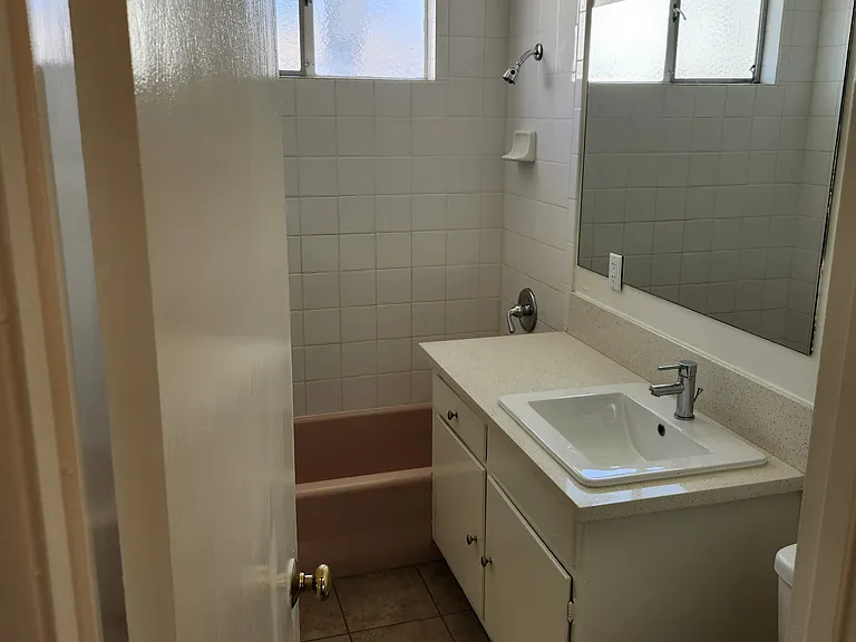 Hall bath between BR 2 and BR 3, full sized tub.