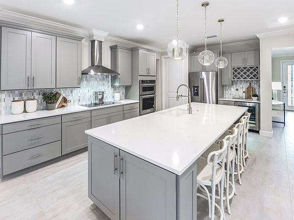 Kitchen with stainless steel appliances with large center island