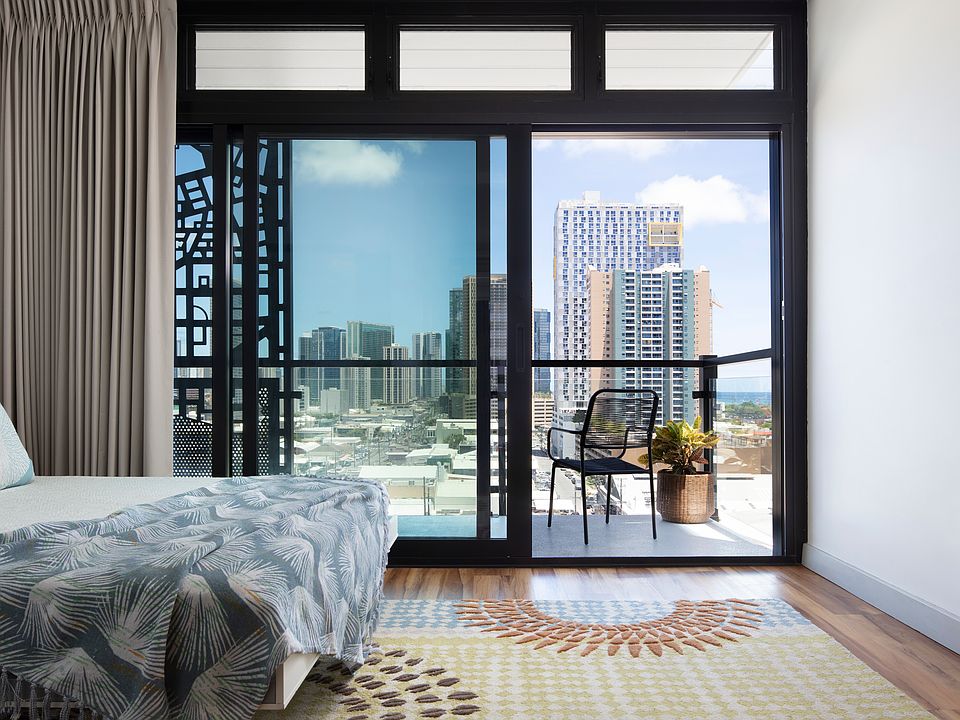 Bedroom Retreat with Skyline Views and Private Balcony.