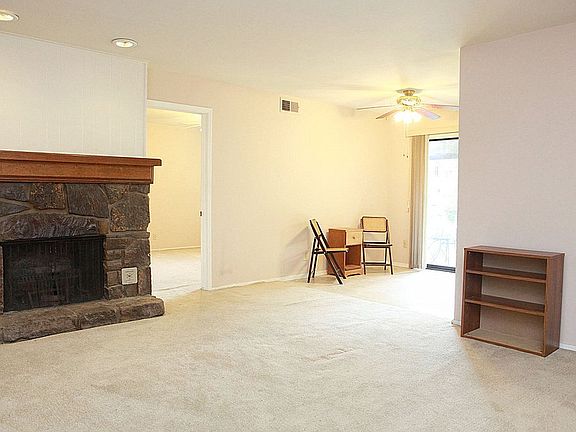 Living room has a fireplace.