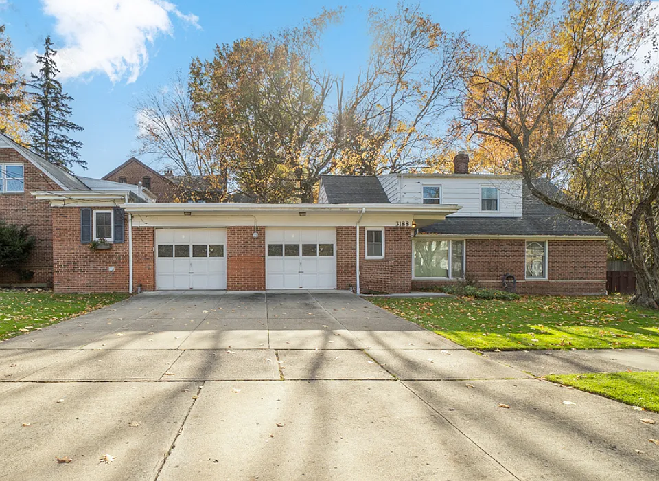 Unit to the right. Part of a duplex, but only connected by garages in the middle. The right garage and driveway space goes with this unit.