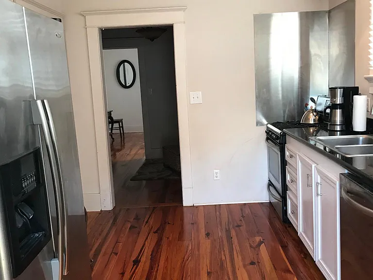 Kitchen facing reading nook and dining room