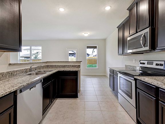 Kitchen Showcases Upgraded Cabinets and Granite Countertops