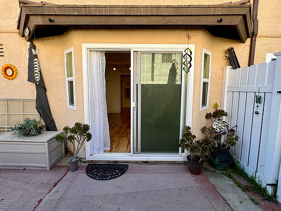 Private entrance with patio area. Sliding door is locking with keys.