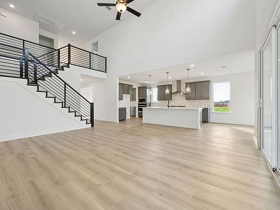 Spacious living area with view of kitchen photos may depict options and features that aren t availa