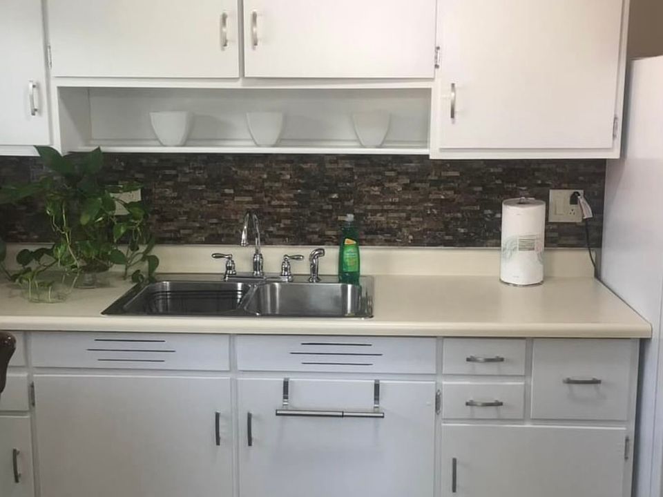 Kitchen, includes stove refrigerator, microwave.