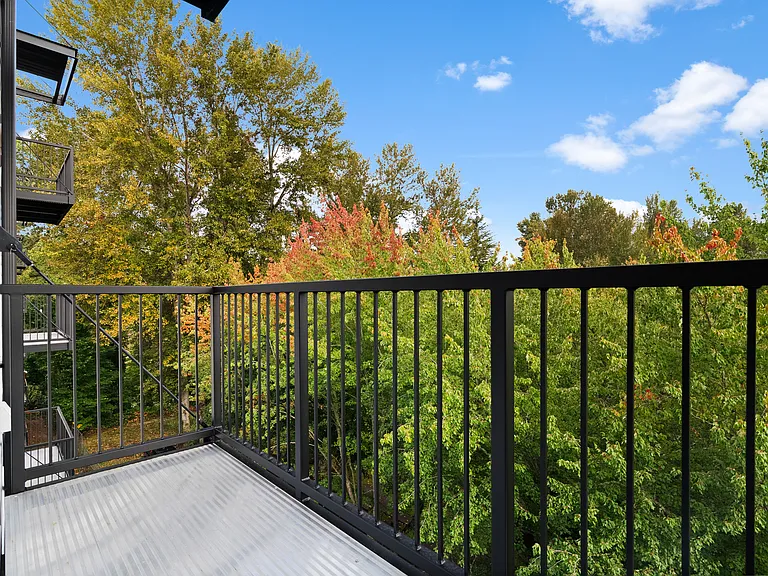 Relax on your private balcony with peaceful treetop views. Relax on your private balcony with peaceful treetop views.