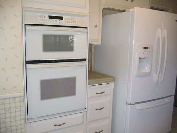There is more cabinet space opposite the sink.
