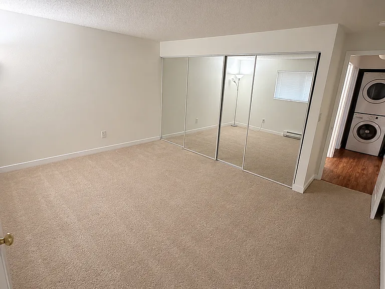 Fresh upgrades throughout master bedroom, new paint, refreshed mirrors, and clean modern finishes.