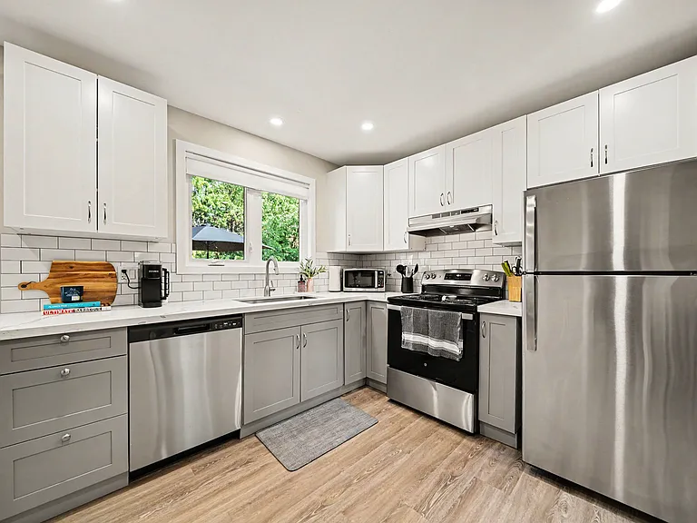 Fully equipped modern kitchen with stainless appliances for all your cooking needs.