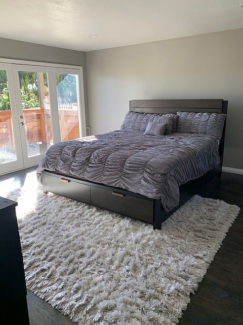 Master bedroom with outdoor balcony and city views