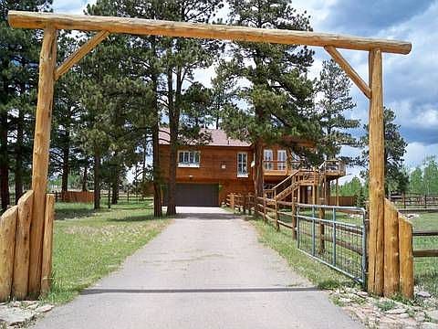Gated home with paved driveway