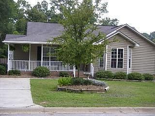 Front of House with Wrap Around Porch