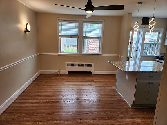 Dining room, newly refinished floors, fresh paint, and new kitchen remodel.
