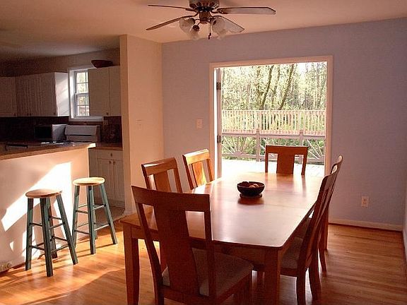 Sunny dining room with access to decks