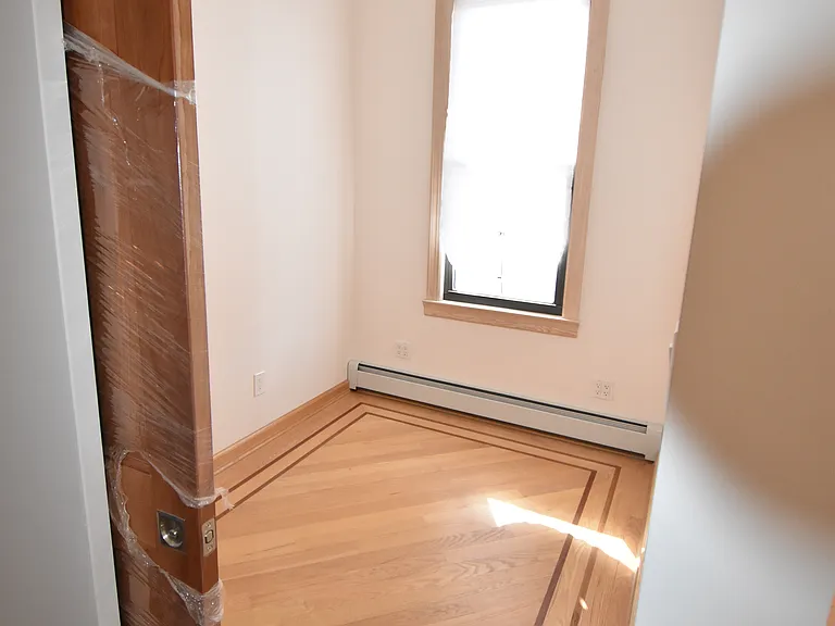 Partial View Home Office with solid cherry pocket door