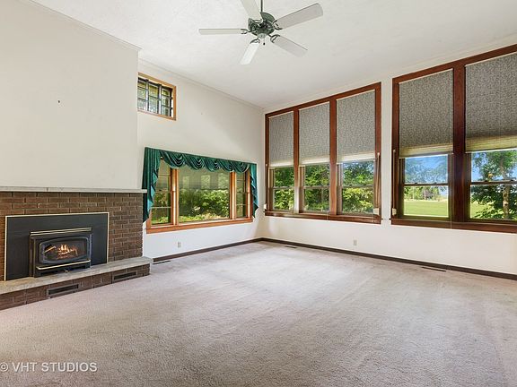 The Windows are very tall and on the outside they have metal shutters that go up and down to protect