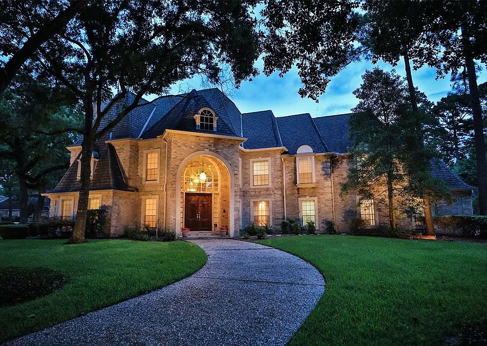 BEAUTIFULLY SITUATED ON A CORNER LOT IN CHAMPION FOREST