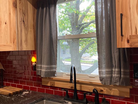 Sink overlooking neighborhood.