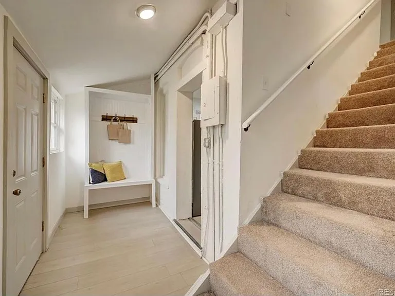 Mudroom with storage space. Stairs to 2nd floor