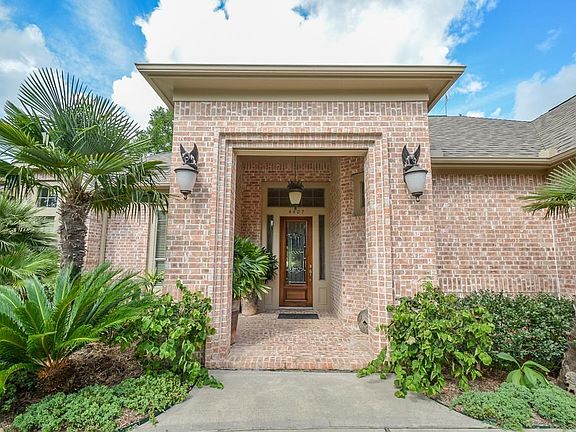 As you approach the front of the home, you will immediately notice the abundance of landscaping and beautiful bricked porch creating an impressive welcome.