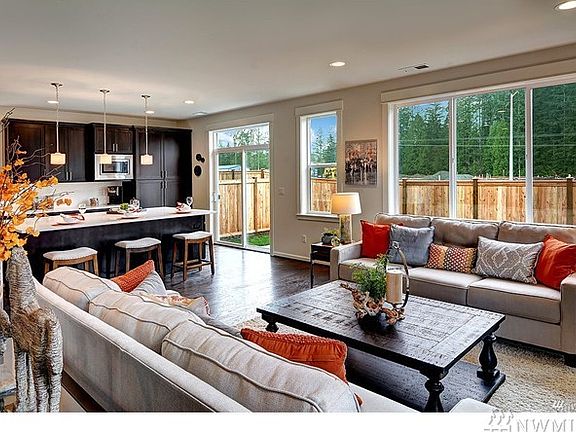Great room opens to gourmet kitchen. Photo not of actual home - may contain optional features.