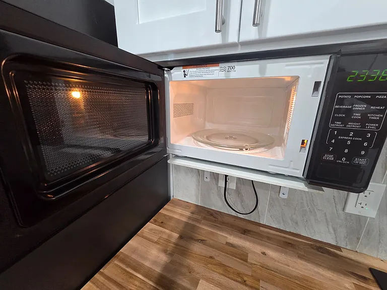 Microwave oven available for quick and easy meal preparation.