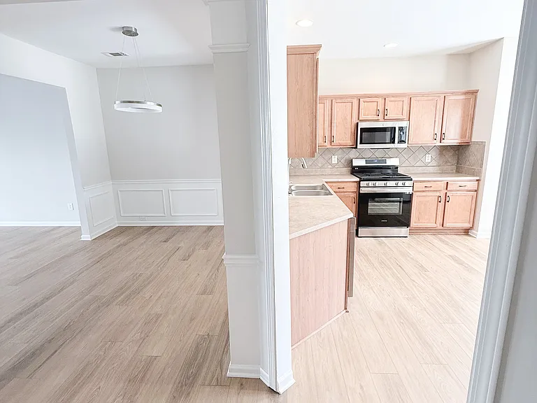 Dining area with opening into kitchen.