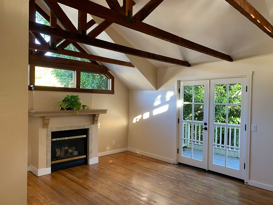 Living Room w/ gas fireplace and french doors to private deck.