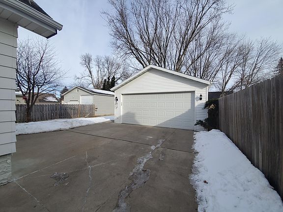 Large 2 car garage with heat and electricity. Another large shed in the backyard and a smoke house!