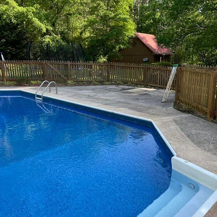 Pool with guest house in background.
