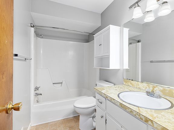 Upstairs Bathroom with floor to ceiling linen closet and laundry chute.