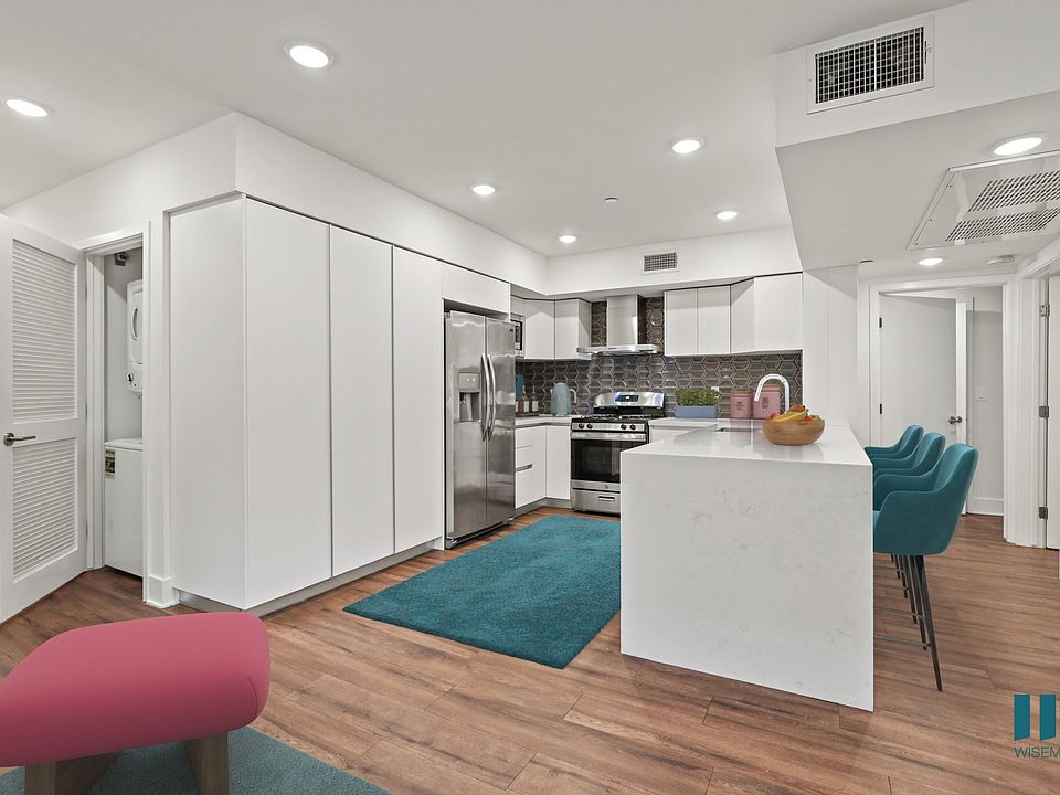 Kitchen with Stainless-Steel Refrigerator, Stove, Dishwasher, and an In-Unit Washer & Dryer