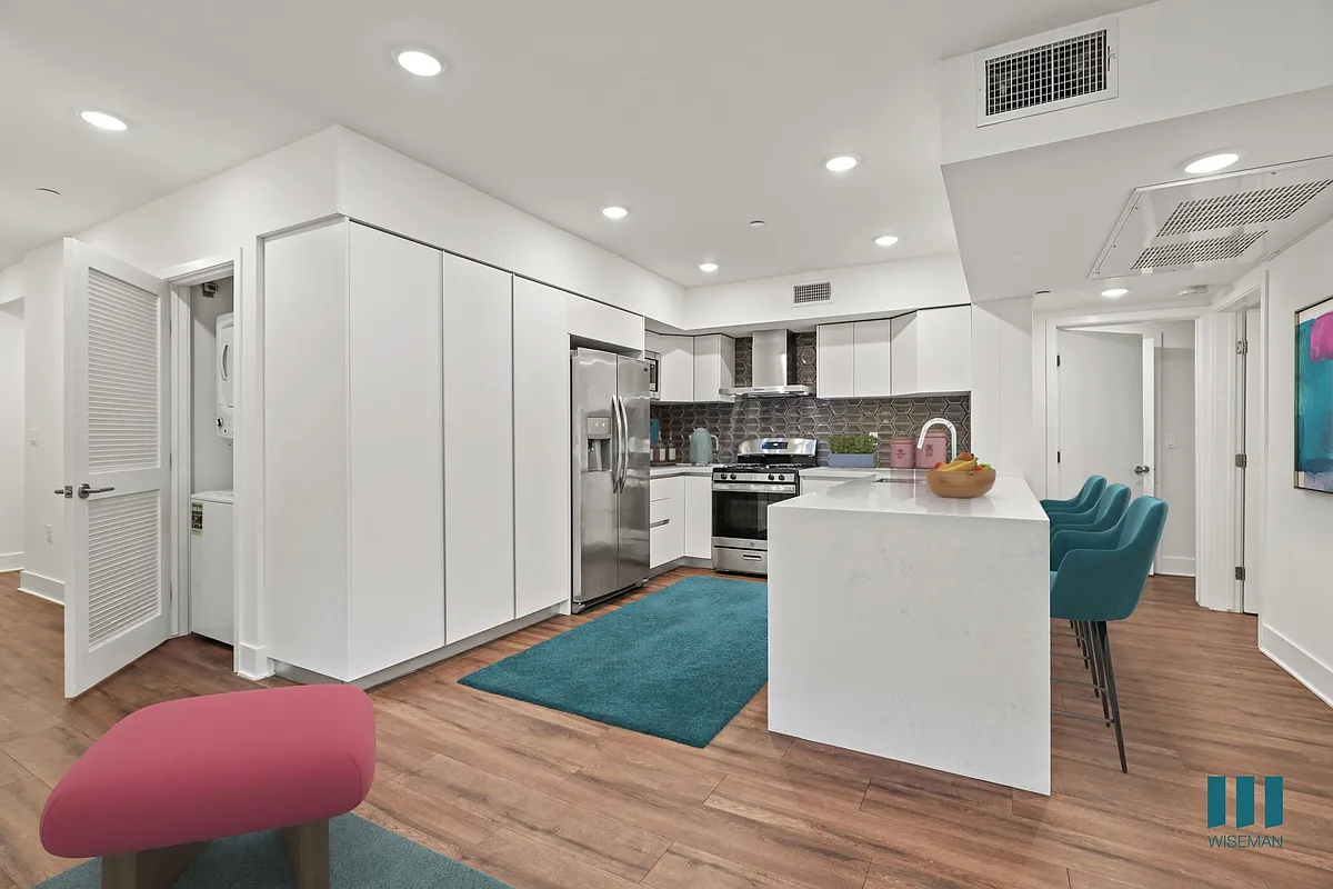 Kitchen with Stainless-Steel Refrigerator, Stove, Dishwasher, and an In-Unit Washer & Dryer - Wellesley Ten by Wiseman