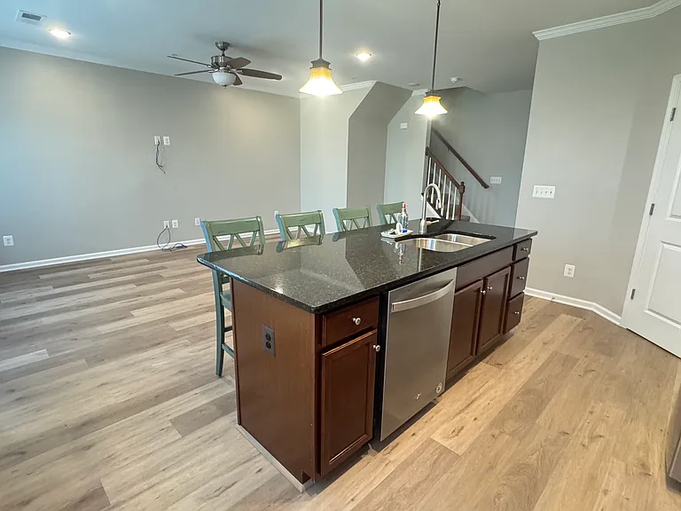 Second floor with kitchen, living area and half bath