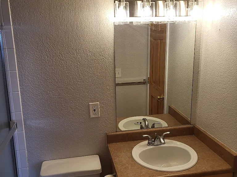 New paint throughout the bathroom, new lighting.