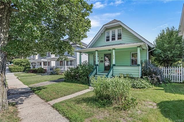 Find your way home to this cozy little craftsman bungalow on a residential stretch of Pemart ave.