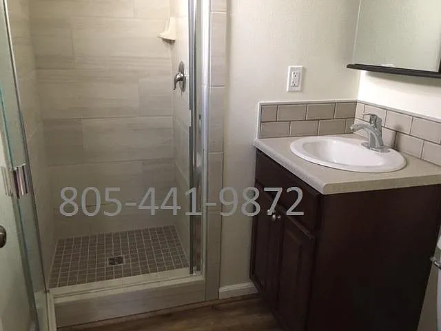 Downstairs bathroom off master bedroom with newly tiled shower