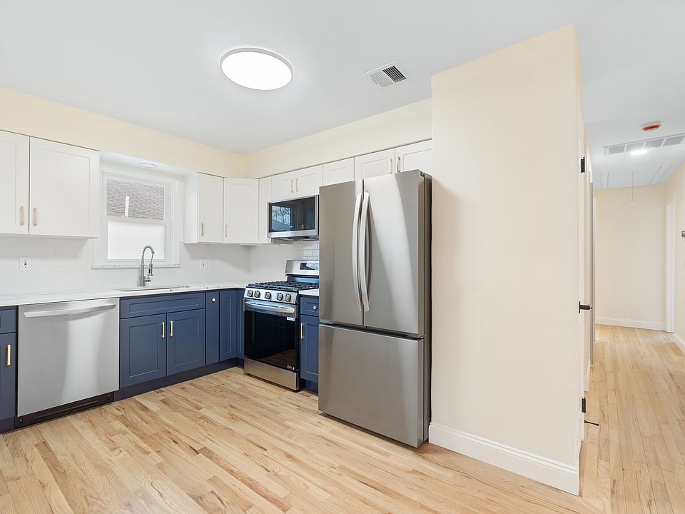 Renovated kitchen with view of hallway