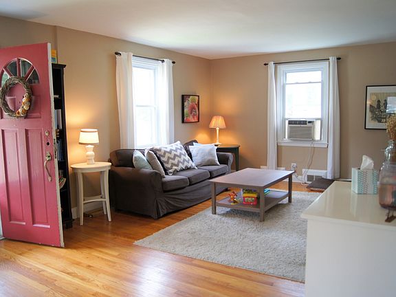 Living room is spacious, across the front of house