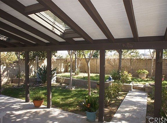 Gorgeous patio cover with skylights. Tons of tree