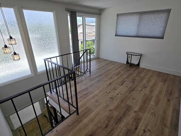 North facing bonus room has attached sun deck accessible via sliding door