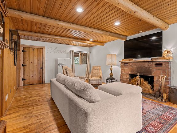 Looking towards front entrance from east end of the living room