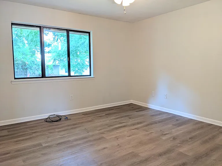 Main bedroom with large window.
